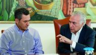 President Michel Temer (L), and his Finance Minister Eduardo Guardia, during a meeting to discuss on the measures to be taken regarding the nation-wide truck drivers' strike, at Planalto Palace in Brasilia, on May 27, 2018. AFP/ Brazilian Presidency