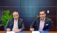 Officials of QIB and QPAY during the signing ceremony.