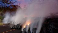 Volcanic gases rise from the Kilauea lava flow that crossed Pohoiki Road near Highway 132, near Pahoa, Hawaii, US, May 28, 2018. REUTERS/Marco Garcia 