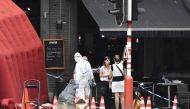 Forensic investigators work at the scene where a gunman shot dead two police officers and a bystander on the Boulevard d'Avroy in the eastern Belgian city of Liege, on May 29, 2018. Belgium OUT / AFP / Belga / ERIC LALMAND