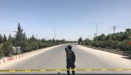 An Afghan policeman keeps watch near the site of an attack and gunfire in Kabul, Afghanistan May 30, 2018. REUTERS/Mohammad Ismail