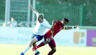 England’s Tom Davies vies for the ball with Qatar’s Nasser Abdulsalam (right) during their Toulon International Championship match played in France yesterday.