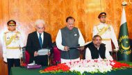 This handout photograph released by the Press Information Department (PID) on June 1, 2018, shows Pakistan's President Mamnoon Hussain (3R) administers the oath to Nasir-ul-Mulk as caretaker Prime Minister during an oath-taking ceremony at The President H