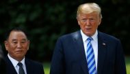 North Korea's envoy Kim Yong Chol poses with U.S. President Donald Trump for a photo by an official photographer as he departs after a meeting at the White House in Washington, U.S., June 1, 2018. REUTERS/Leah Millis