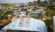 Sand bags are seen on the roof of a shelter to weigh it down in preparation for the upcoming monsoon season in Kutupalong refugee camp in Ukhia.AFP / Munir UZ ZAMAN 
