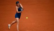 Russia's Maria Sharapova returns the ball to Czech Republic's Karolina Pliskova during their women's singles third round match on day seven of The Roland Garros 2018 French Open tennis tournament in Paris on June 2, 2018. (AFP / CHRISTOPHE SIMON)