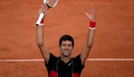 Serbia's Novak Djokovic celebrates after victory over Spain's Fernando Verdasco during their men's singles fourth round match on day eight of The Roland Garros 2018 French Open tennis tournament in Paris on June 3, 2018. / AFP / Thomas SAMSON
