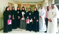 Manar Khalifa Al Muraikhi, Director of PR and Corporate Communications of Ooredoo, with Ooredoo volunteers, during the visit to Hamad General Hospital’s children’s ward.