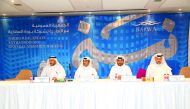 Barwa Real Estate Company officials during the Extraordinary General Assembly meeting.