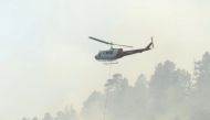 A helicopter drops water on the 416 Fire near Durango, Colorado, U.S. in this June 4, 2018 handout photo obtained by Reuters June 5, 2018. La Plata County/Handout via REUTERS 