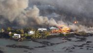 Lava destroys homes in the Kapoho area, east of Pahoa, during ongoing eruptions of the Kilauea Volcano in Hawaii, U.S., June 5, 2018. REUTERS/Terray Sylvester