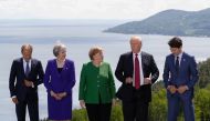European Council President Donald Tusk, Britain's Prime Minister Theresa May, Germany's Chancellor Angela Merkel, U.S. President Donald Trump and Canada's Prime Minister Justin Trudeau pose during a family photo at the G7 Summit in the Charlevoix city of 