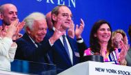 Executive Chairman and Chief Creative Officer Ralph Lauren with the NYSE President Stacey Cunningham (R) rings the closing bell to celebrate 50 years at the Dow Industrial Average at the New York Stock Exchange on June 7, 2018 in New York.  AFP / Bryan R 