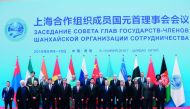 Russian President Vladimir Putin during a photo session of the SCO Heads of State, heads of observer nations and leaders of international organisations ahead of an expanded format meeting of the SCO Council of Head of State in Qingdao. From left, front ro