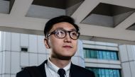(FILES) In this file photo taken on January 18, 2018, pro-independence protestor Edward Leung arrives at the High Court before facing rioting charges in Hong Kong, for his part in the 'fishball riots' that took place in February 2016. AFP / Anthony Wallac