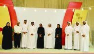 The officials of Ooredoo and Ehsan pose during the visit. 