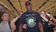 Retired American professional basketball player Dennis Rodman speaks to the press as he arrives at Changi International airport ahead of US-North Korea summit in Singapore on June 11, 2018. AFP / ADEK BERRY
