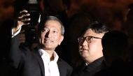 Singapore's Foreign Minister Vivian Balakrishnan takes a selfie with North Korea's leader Kim Jong Un during a visit in Merlion Park in Singapore, in this photo taken by Kyodo June 11, 2018. Kyodo/via Reuters