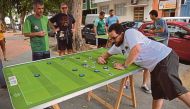 Every weekend, some 20 to 30 players meet in Rio de Janeiro to play with their customised colourful buttons, inspired in teams around the world and in legendary players. AFP
