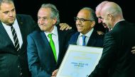 FIFA president Gianni Infantino (R) poses with the United 2026 bid (Canada-Mexico-US) officials Carlos Cordeiro (3rd R), president of the United States Football Association, president of the Mexican Football Association Decio de Maria Serrano (2nd L), Ste