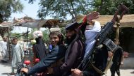 Afghan Taliban militants ride a motorbike as they took to the street to celebrate ceasefire on the second day of Eid in the outskirts of Jalalabad on June 16, 2018. (AFP / NOORULLAH SHIRZADA)