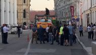 A damaged taxi, which ran into a crowd of people, is evacuated in central Moscow, Russia June 16, 2018. (REUTERS/Jack Stubbs)