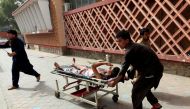 An injured man is pushed on a stretcher to a hospital after a car bomb in Jalalabad city, Afghanistan on June 17, 2018. REUTERS/Parwiz