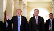 US President Donald Trump (L) walks next to US House Majority Leader Kevin McCarthy (R-CA) after a meeting at the US Capitol with the House Republican Conference in Washington, DC on June 19, 2018. AFP / Mandel Ngan