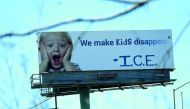A vandalized 1-800-GOT-JUNK billboard shows a message in in protest with the Immigration and Customs Enforcement (ICE) and their participation in separating children from their parents trying to enter the U.S. from Mexico on June 21, 2018 in Emeryville, C