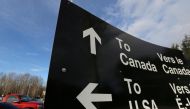 File photo of a sign giving directions to Canada and the United States border February 16, 2017, used for representation purposes only. REUTERS/Chris Helgren/File Photo