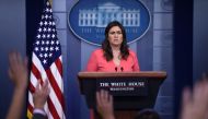 White House spokesperson Sarah Huckabee Sanders takes questions during a press briefing at the White House in Washington, DC on June 18, 2018. / AFP / Brendan SMIALOWSKI