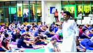 Vishnu Prasad, a Yoga instructor, train people to do Yoga at Sheraton Grand Hotel Doha to mark the International Yoga Day. 