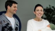 New Zealand Prime Minister Jacinda Ardern carries her newborn baby Neve Te Aroha Ardern Gayford with her partner Clarke Gayford as she walks out of the Auckland Hospital in New Zealand, June 24, 2018. REUTERS/Ross Land
