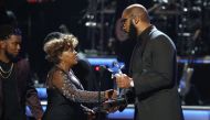 Tyler Perry (R) presents the Lifetime Achievement Award to Anita Baker. REUTERS/Mario Anzuoni
 