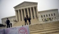 In this file photo taken on April 25, 2018 activists rally against the Muslim Ban in front of the court in Washington. (AFP / Andrew CABALLERO-REYNOLDS)