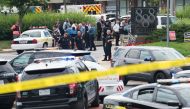 Police respond to a shooting at the offices of the Capital Gazette, a daily newspaper, in Annapolis, Maryland, June 28, 2018. The local ABC7 news reported 