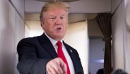US President Donald Trump speaks to the press aboard Air Force One in flight as he travels from Joint Base Andrews in Maryland, to Bedminster, New Jersey, June 29, 2018. / AFP / SAUL LOEB