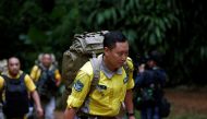 Chinese rescue team arrive, near the Tham Luang cave complex, as an ongoing search for members of an under-16 soccer team and their coach continues, in the northern province of Chiang Rai, Thailand, June 30, 2018. REUTERS/Soe Zeya Tun