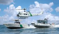 FILE PHOTO: CBP Air and Marine Intrepid and SafeBoat vessels accompanied on patrol by a UH-1 Huey near San Diego, CA..(Wikimedia Commons)