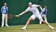 US player John Isner returns against Belgium's Ruben Bemelmans during their men's singles second round match on the fourth day of the 2018 Wimbledon Championships at The All England Lawn Tennis Club in Wimbledon, southwest London, on July 5, 2018. (AFP / 
