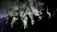 Military personnel are seen in front of the Tham Luang cave, where 12 boys and their soccer coach are trapped, in the northern province of Chiang Rai, Thailand, July 6, 2018. REUTERS/Athit Perawongmetha 