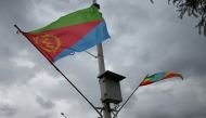 FILE PHOTO: Ethiopian and Eritrean flags flutter during the welcoming ceremony of Eritrean Foreign Minister Osman Saleh and his delegation at the Bole International Airport in Addis Ababa, Ethiopia June 26, 2018. REUTERS/Tiksa Negeri/File Photo
