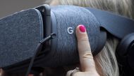 An attendee wears VR goggles at the Google digital workshop stand at the Labour Party Conference venue in Brighton, Britain, September 26, 2017. (Reuters / Toby Melville) 