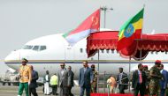 Eritrea's President Isaias Afwerki is welcomed by Ethiopian Prime Minister Abiy Ahmed upon arriving for a three-day visit, at the Bole international airport in Addis Ababa, Ethiopia July 14, 2018. REUTERS/Tiksa Negeri
