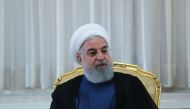 A handout picture provided by the Iranian presidency shows the Iranian president Hassan Rouhani (C) during a meeting in Tehran on July 14, 2018. AFP / IRANIAN PRESIDENCY / HO