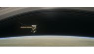 This artist's rendering shows Cassini as the spacecraft makes one of its final five dives through Saturn's upper atmosphere in August and September 2017.