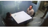 Handout picture released by the Mexican Interior Ministry on January 20, 2017 shows Joaquin Guzman Loera aka El Chapo Guzman (R) sitting in a chair as he is extradited to the US in an unknowen location (AFP) 