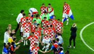 Croatian players shake hands with their French counterparts following the FIFA 2018 World Cup final on Sunday.