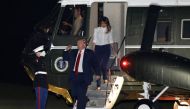 U.S. President Donald Trump salutes as he returns with First Lady Melania Trump to the White House in Washington, U.S. from Helsinki, Finland, July 16, 2018. REUTERS/Yuri Gripas