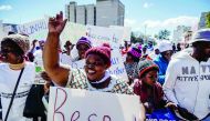 A demonstrator holds a placard on July 19, 2018 as she takes part in a march for peace organised by Churches Convergence on Peace Project, ahead of the Zimbabwe elections in Bulawayo, Zimbabwe. AFP / Zinyange Auntony